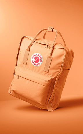 Fjällräven Kånken Classic backpack in warm orange, showcasing iconic Scandinavian design and versatile everyday functionality.