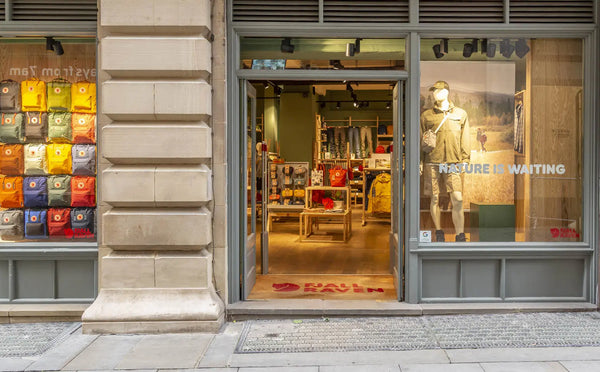 Exterior of our Fjällräven store displaying various Kånken bags in the window, inviting shoppers to explore Fjällräven products.