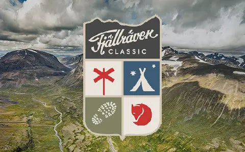 Fjällräven Classic event logo over an aerial view of mountainous terrain, symbolising outdoor adventure and trekking in rugged landscapes